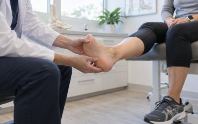Foot Doctor examining patient foot